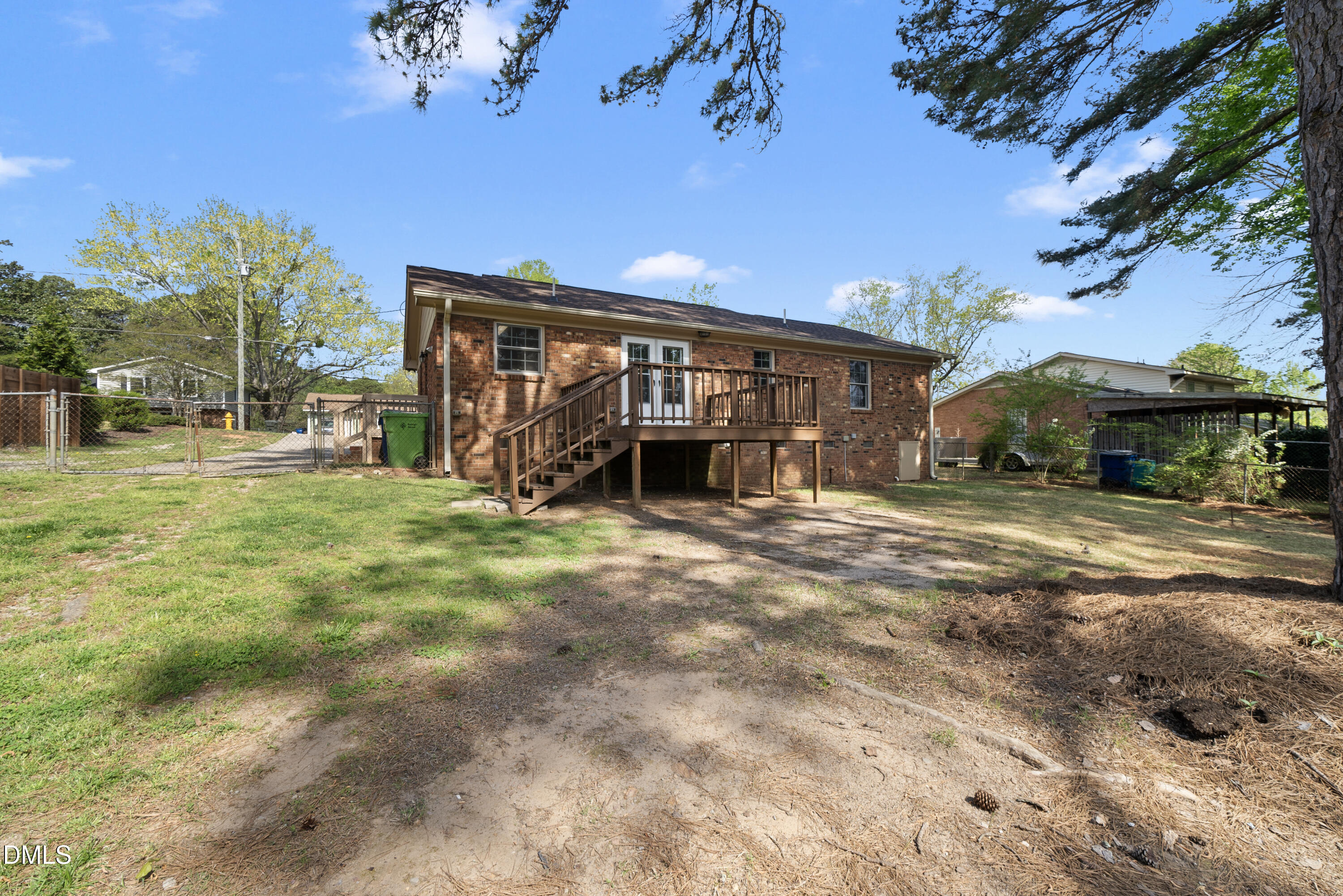 2123 Shenandoah Road Raleigh, NC 27603 - Photo 5 of 26 a view of a house with backyard and a tree