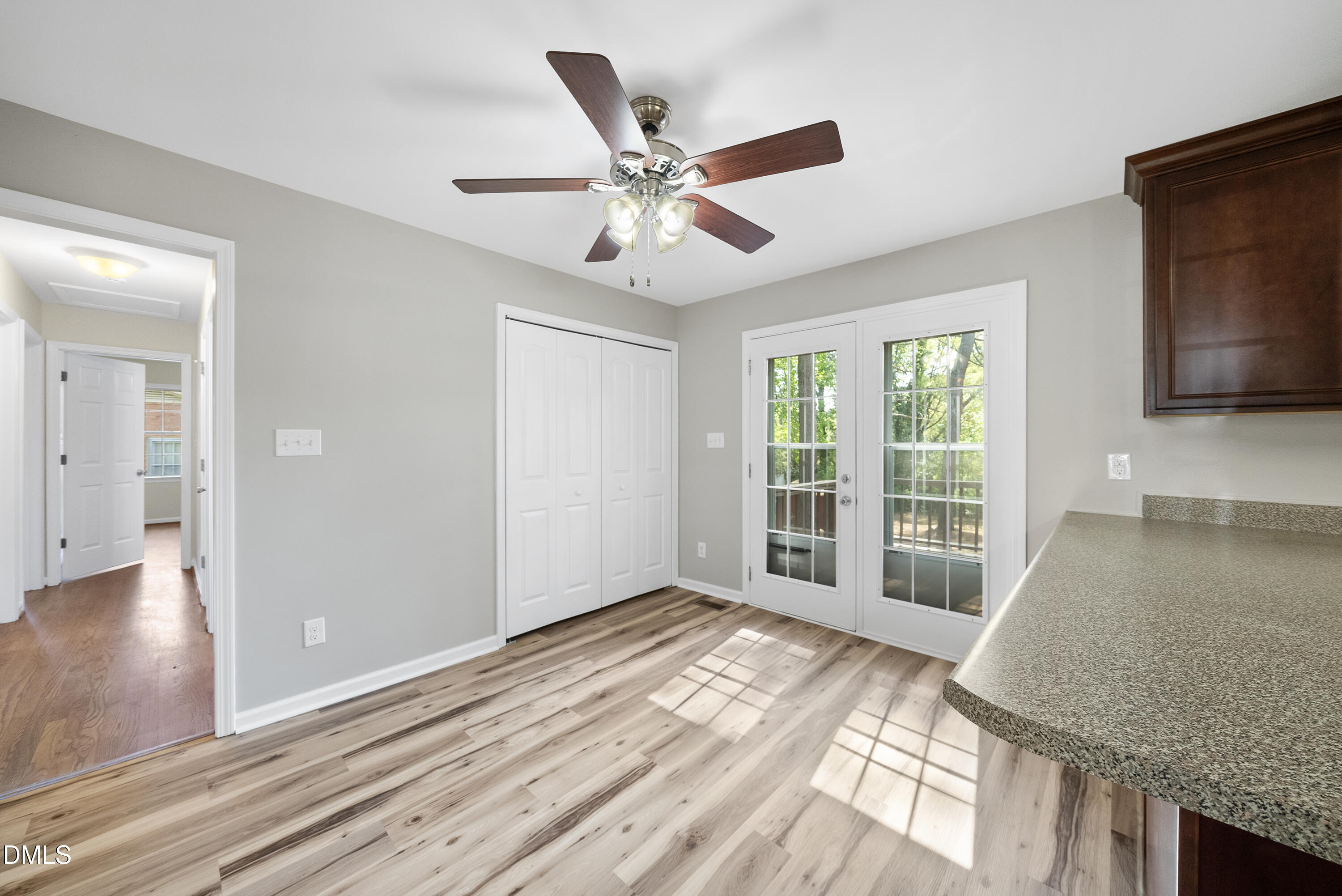 2123 Shenandoah Road Raleigh, NC 27603 - Photo 8 of 26 a view of empty room with wooden floor and fan