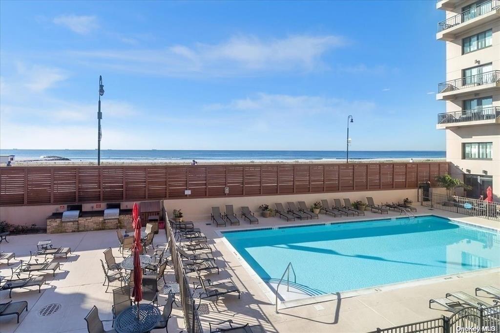 100 West Broadway, Unit 2K Long Beach, NY 11561 - Photo 1 of 1 Pool featuring a patio area and a water view