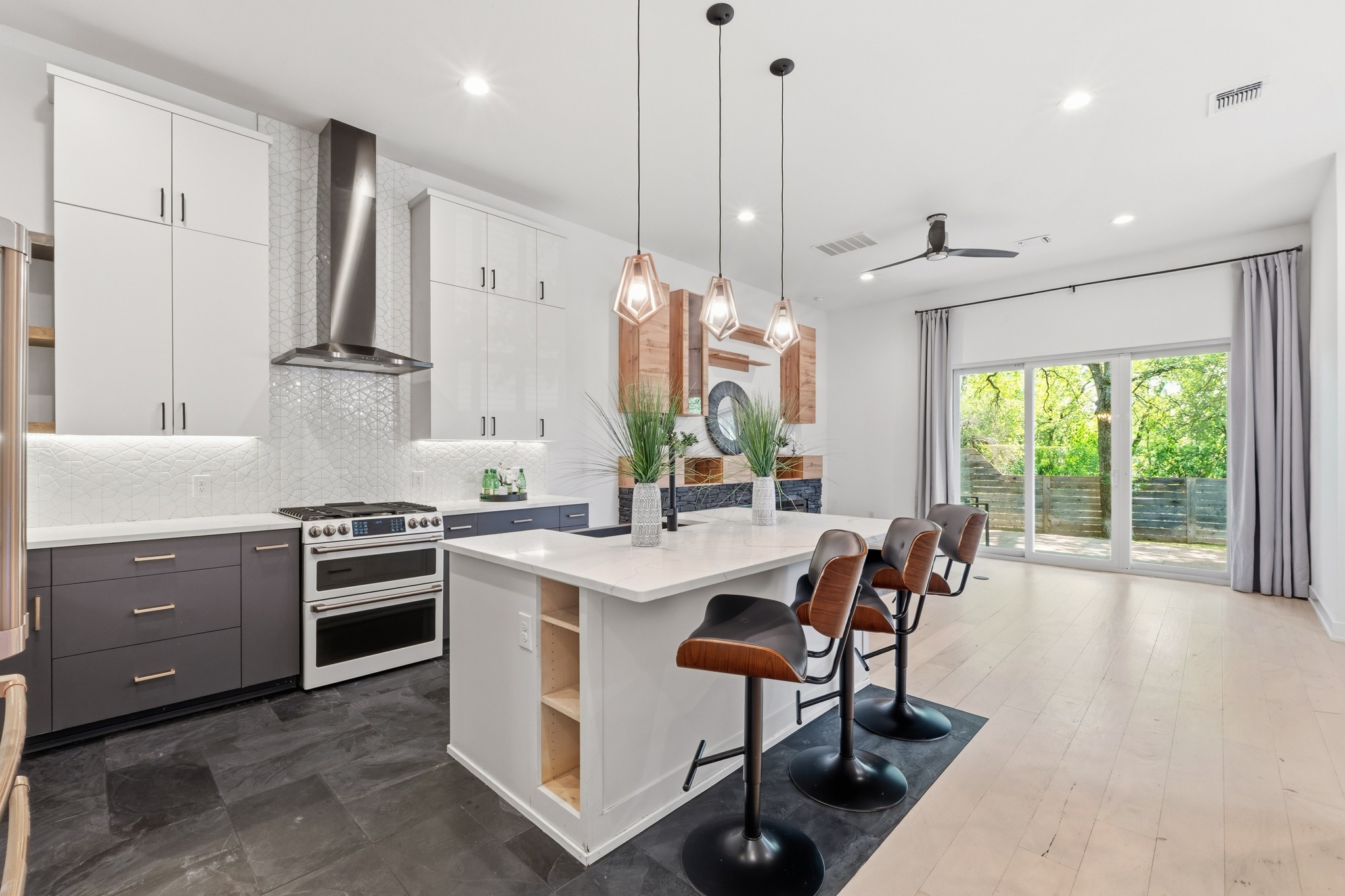 3304 East 17th Street, Unit B Austin, TX 78721 - Photo 5 of 35 Luxurious Chefs kitchen with Cafe appliances , quartz counters, large island with bar stool seating. This condo lives like a single family home.
