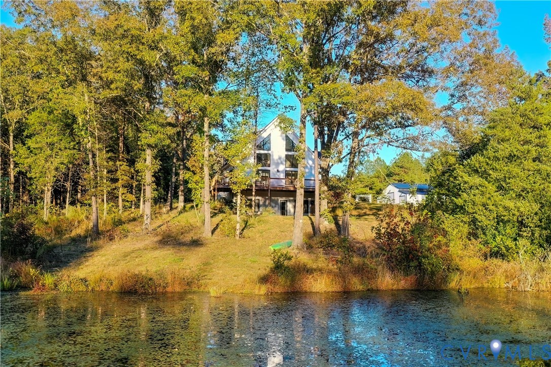 Side view of property featuring a water view
