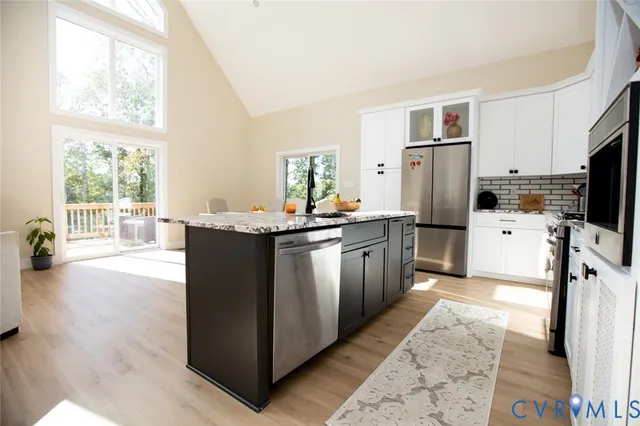 a kitchen with a sink stove and refrigerator