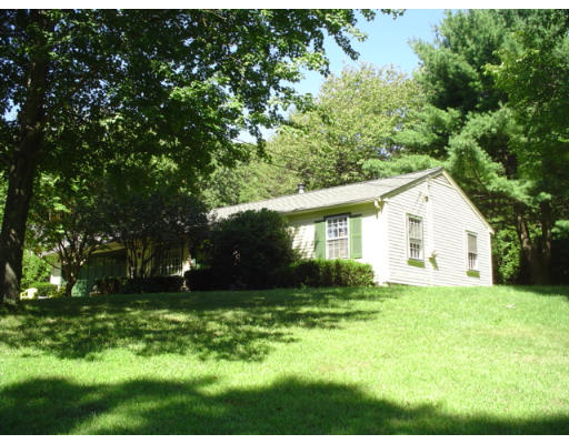 129 Chestnut Hill Road Groton, MA 01450 - Photo 1 of 8 a view of a house with a yard