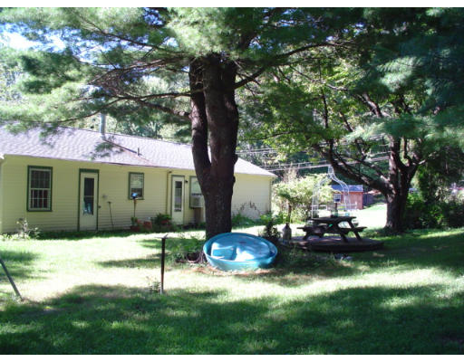 129 Chestnut Hill Road Groton, MA 01450 - Photo 4 of 8 a view of a house with backyard