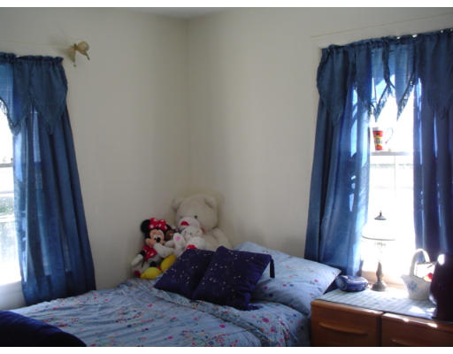 129 Chestnut Hill Road Groton, MA 01450 - Photo 8 of 8 a bed room with a bed and a window