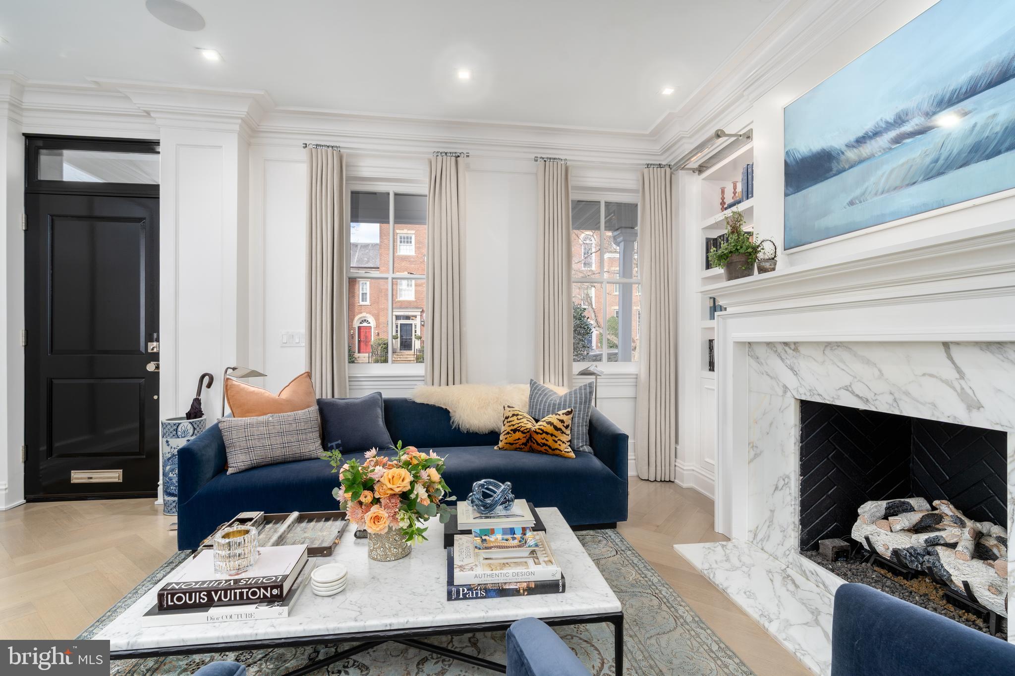 1639 35th Street Northwest Washington, DC 20007 - Photo 20 of 60 a living room with furniture and a fireplace