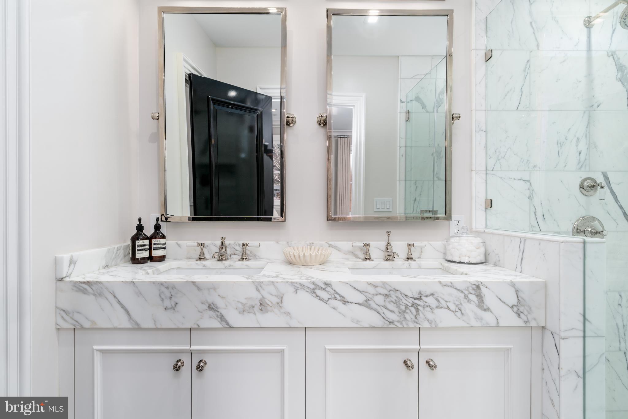1639 35th Street Northwest Washington, DC 20007 - Photo 33 of 60 a bathroom with double sink and a mirror