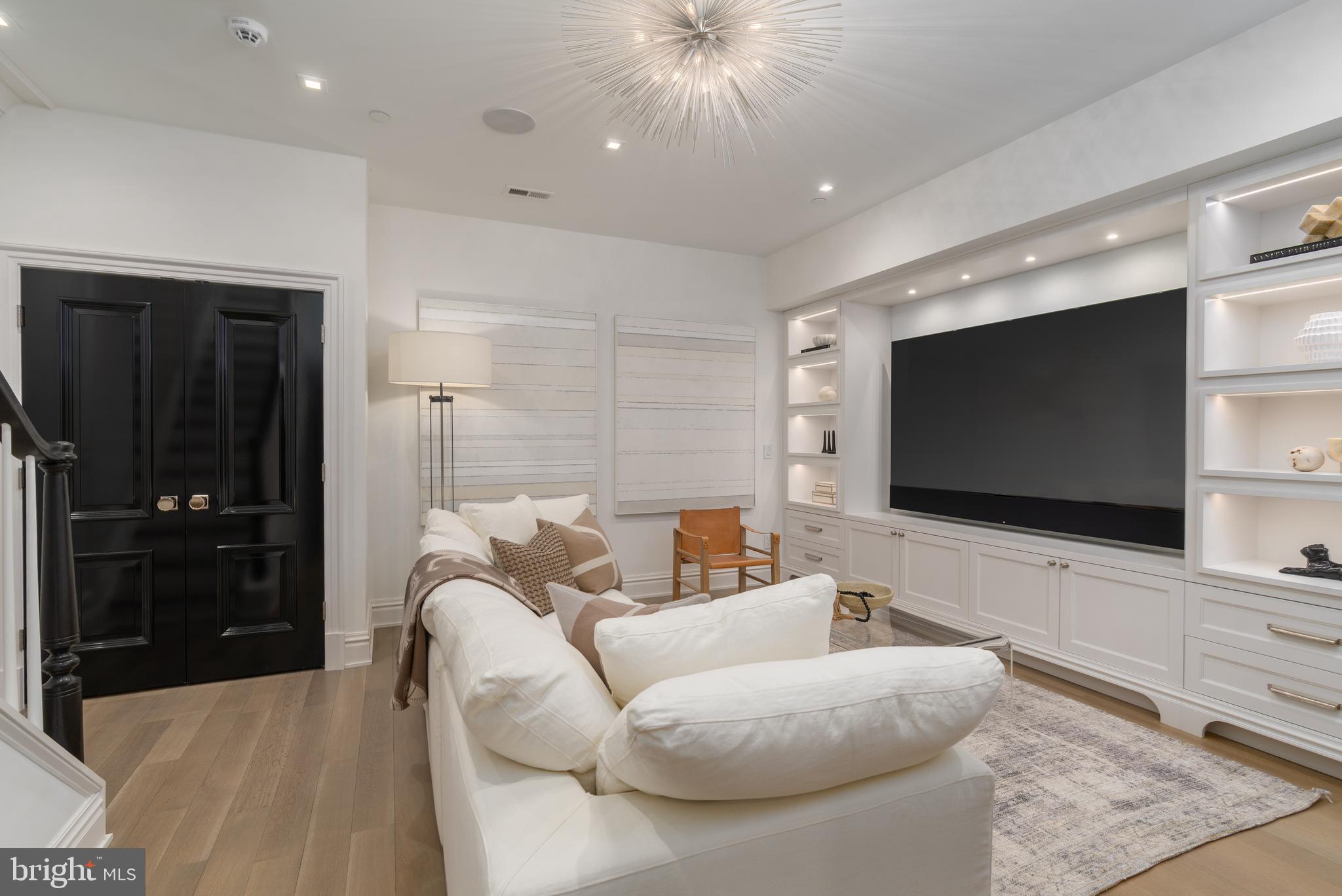 1639 35th Street Northwest Washington, DC 20007 - Photo 42 of 60 a living room with furniture and a flat screen tv