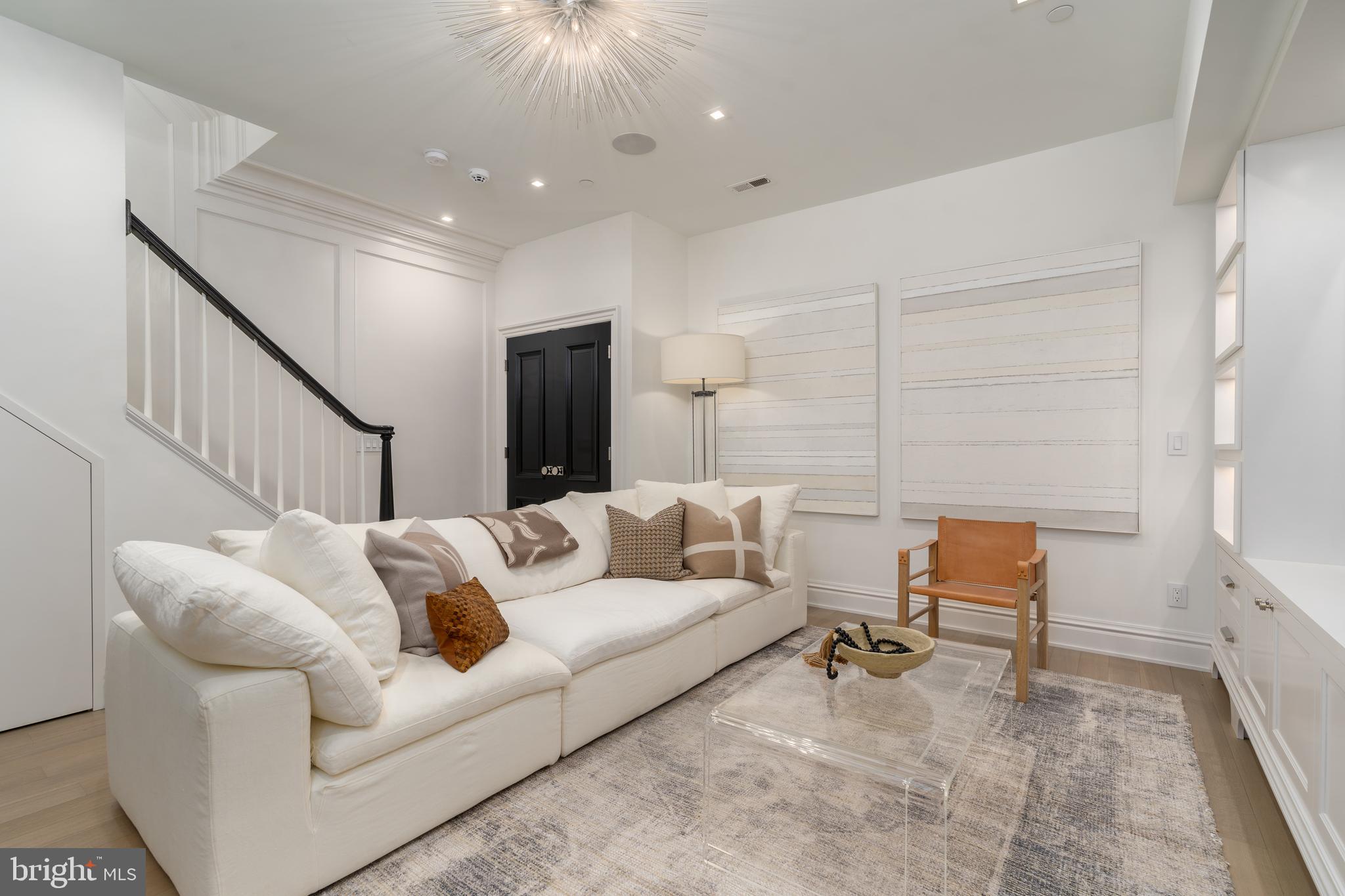 1639 35th Street Northwest Washington, DC 20007 - Photo 43 of 60 a living room with furniture and a potted plant