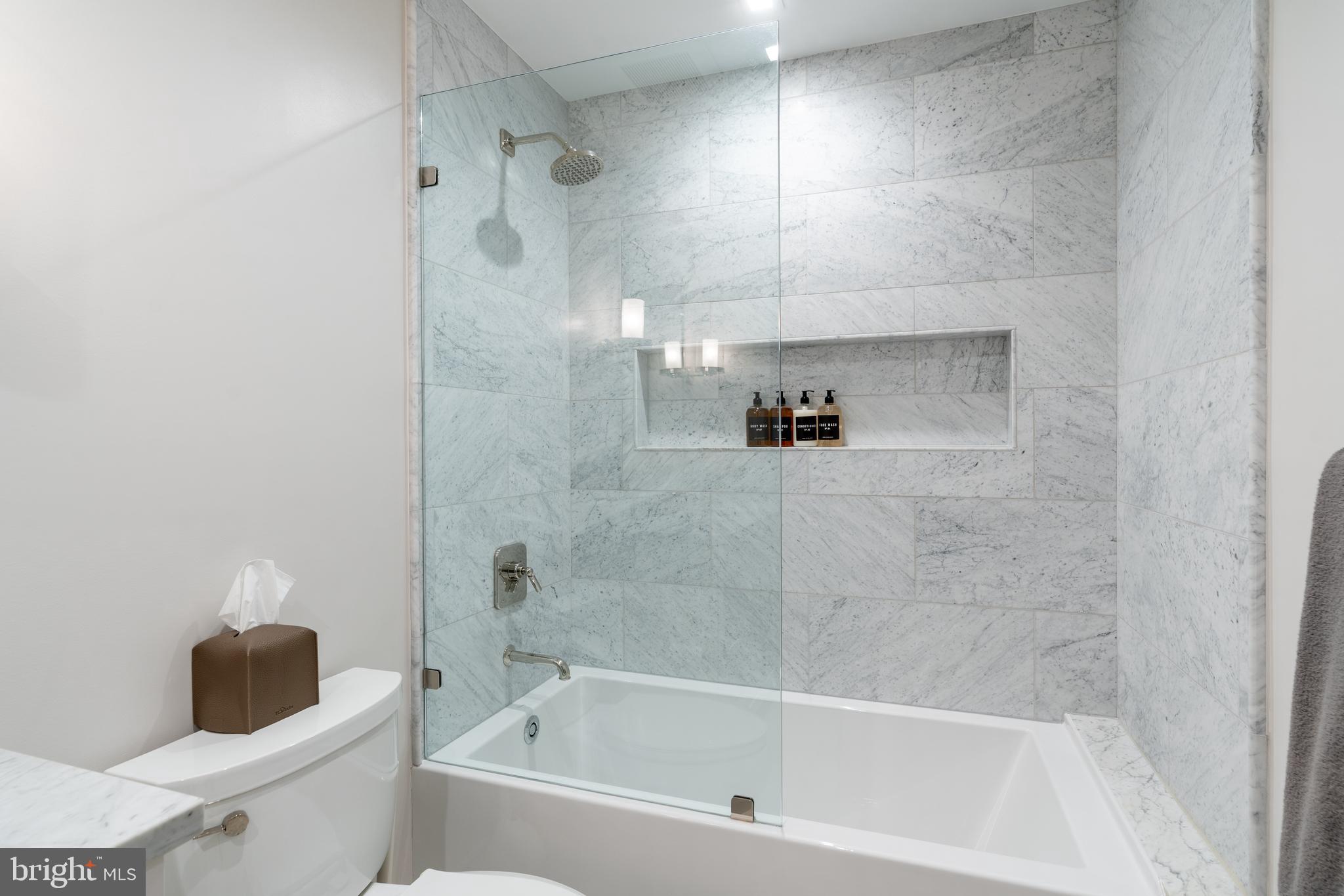 1639 35th Street Northwest Washington, DC 20007 - Photo 46 of 60 a bathroom with a bathtub and a shower