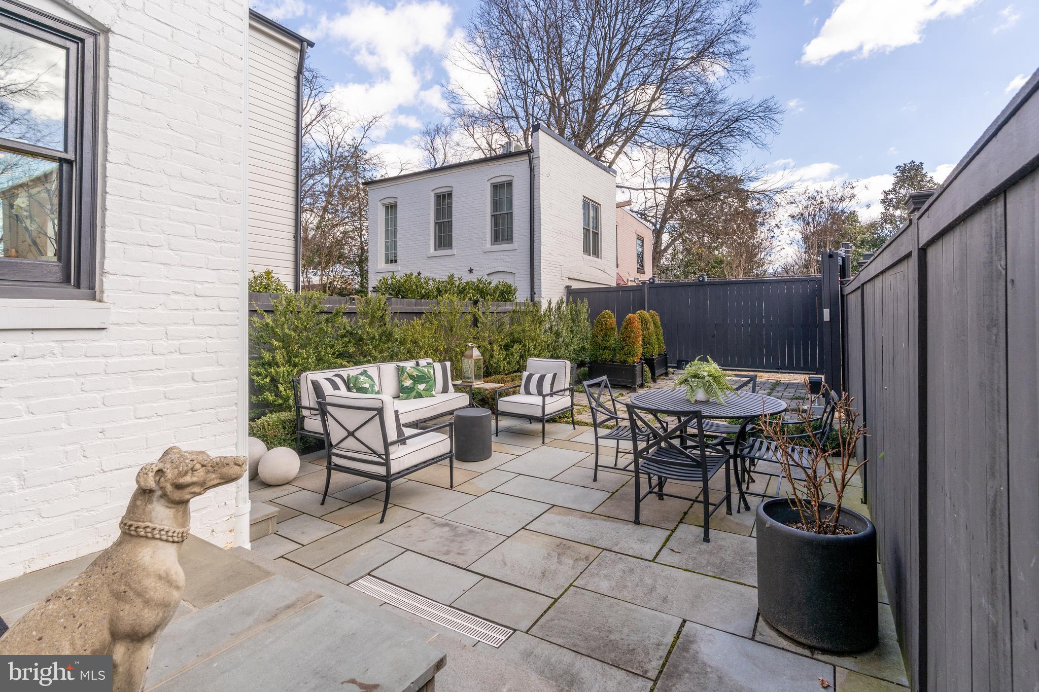 1639 35th Street Northwest Washington, DC 20007 - Photo 51 of 60 a view of a chairs and table in backyard of the house