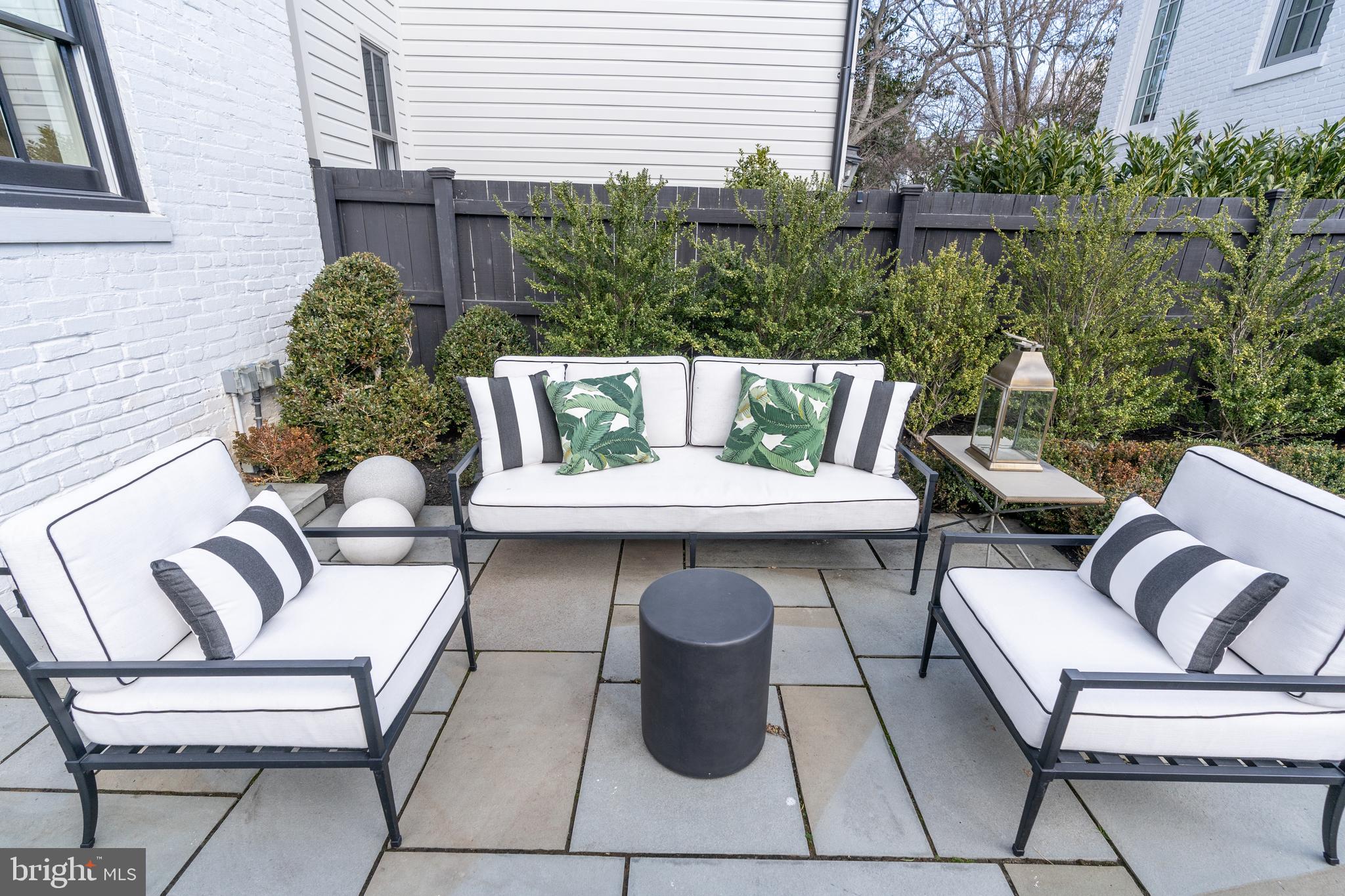 1639 35th Street Northwest Washington, DC 20007 - Photo 53 of 60 a view of a patio with couches table and chairs and potted plants