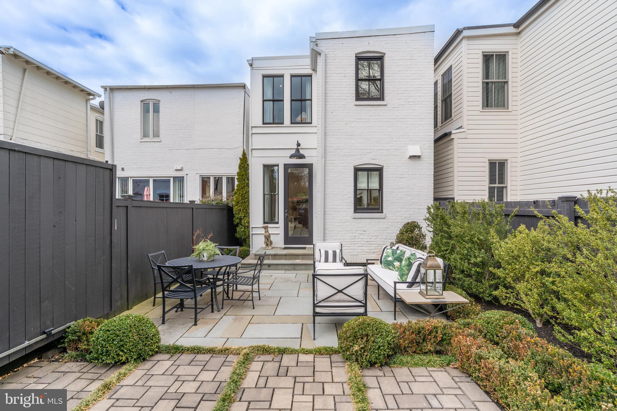 1639 35th Street Northwest Washington, DC 20007 - Photo 58 of 60 a balcony with furniture and potted plants