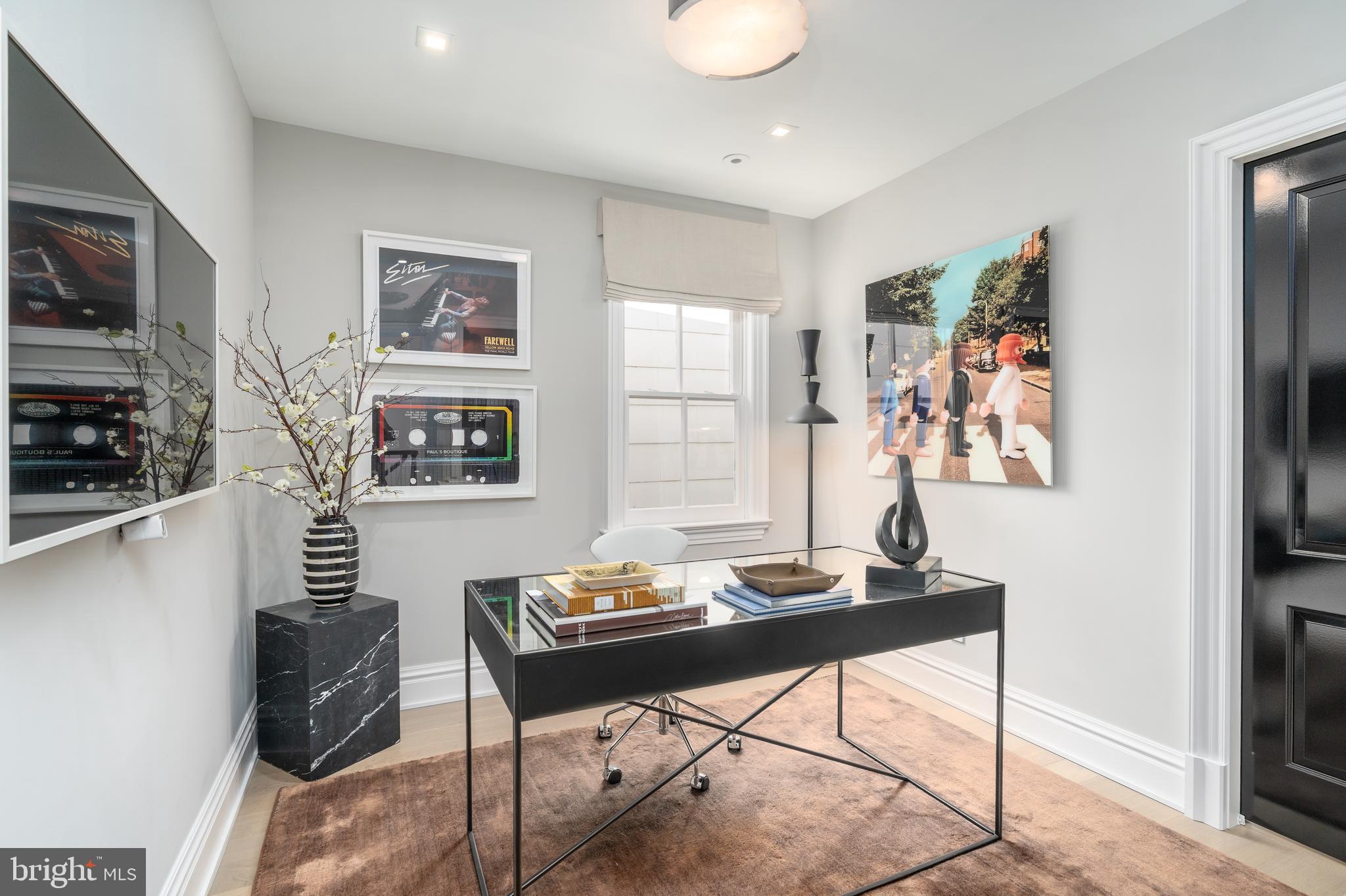 1639 35th Street Northwest Washington, DC 20007 - Photo 10 of 60 a living room with furniture a flat screen tv and a window