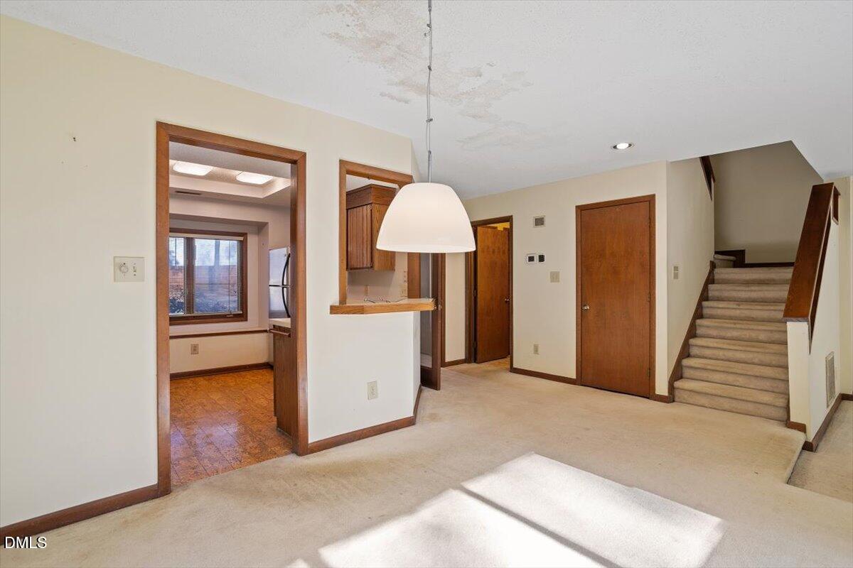 4329 Southwind Drive Raleigh, NC 27613 - Photo 14 of 30 a view of a room with cabinet and a flat screen tv