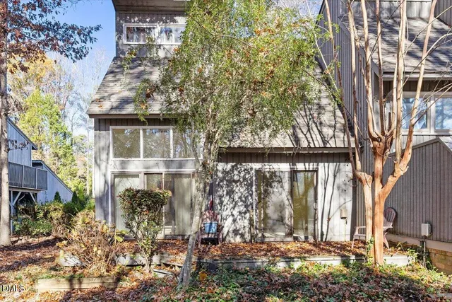 a view of a house with a tree