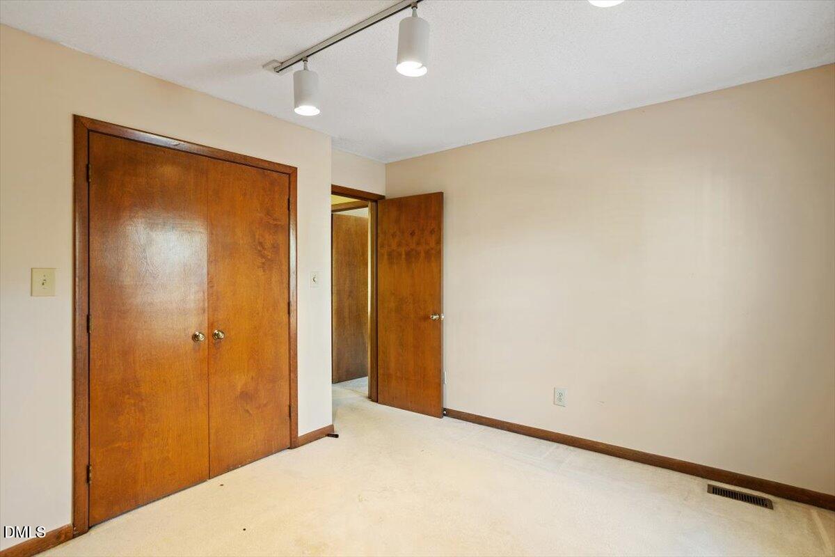 4329 Southwind Drive Raleigh, NC 27613 - Photo 27 of 30 a view of an empty room