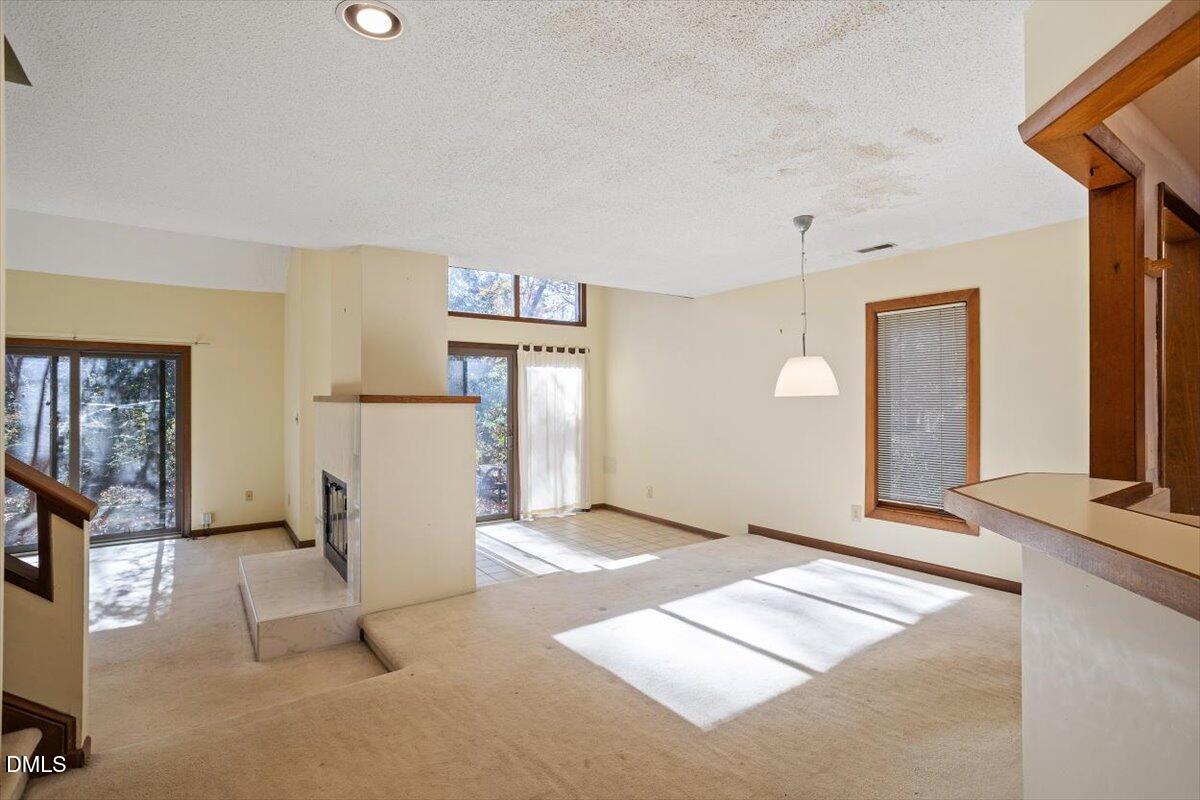 4329 Southwind Drive Raleigh, NC 27613 - Photo 2 of 30 a view of a livingroom with a staircase