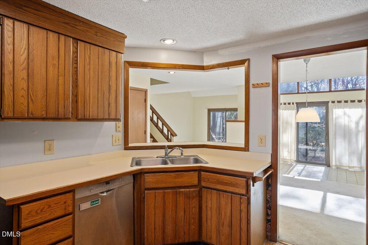 4329 Southwind Drive Raleigh, NC 27613 - Photo 3 of 30 a kitchen with a sink and a cabinets