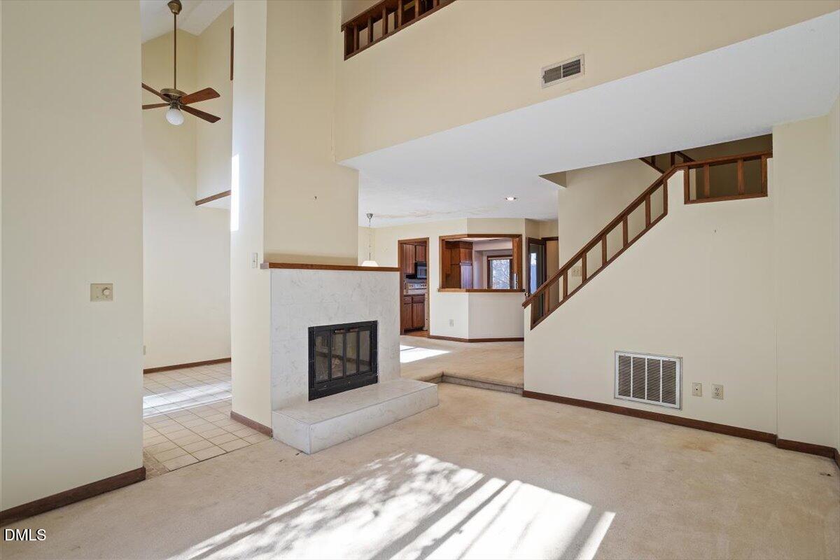 4329 Southwind Drive Raleigh, NC 27613 - Photo 7 of 30 a view of a livingroom with a fireplace