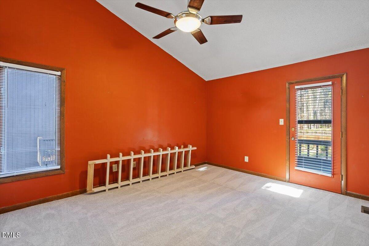4329 Southwind Drive Raleigh, NC 27613 - Photo 9 of 30 a view of an empty room with a window