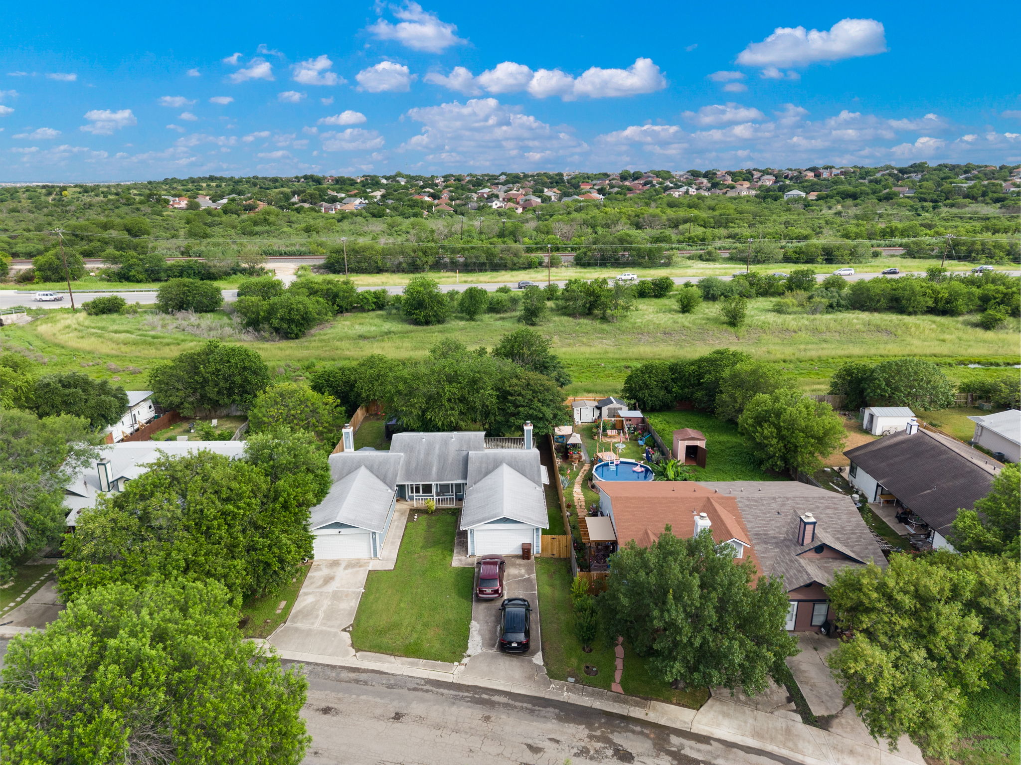 8317 Forest Ridge Drive San Antonio, TX 78239 - Photo 24 of 26 An aerial perspective reveals a residential community nestled among mature trees and verdant landscapes.
