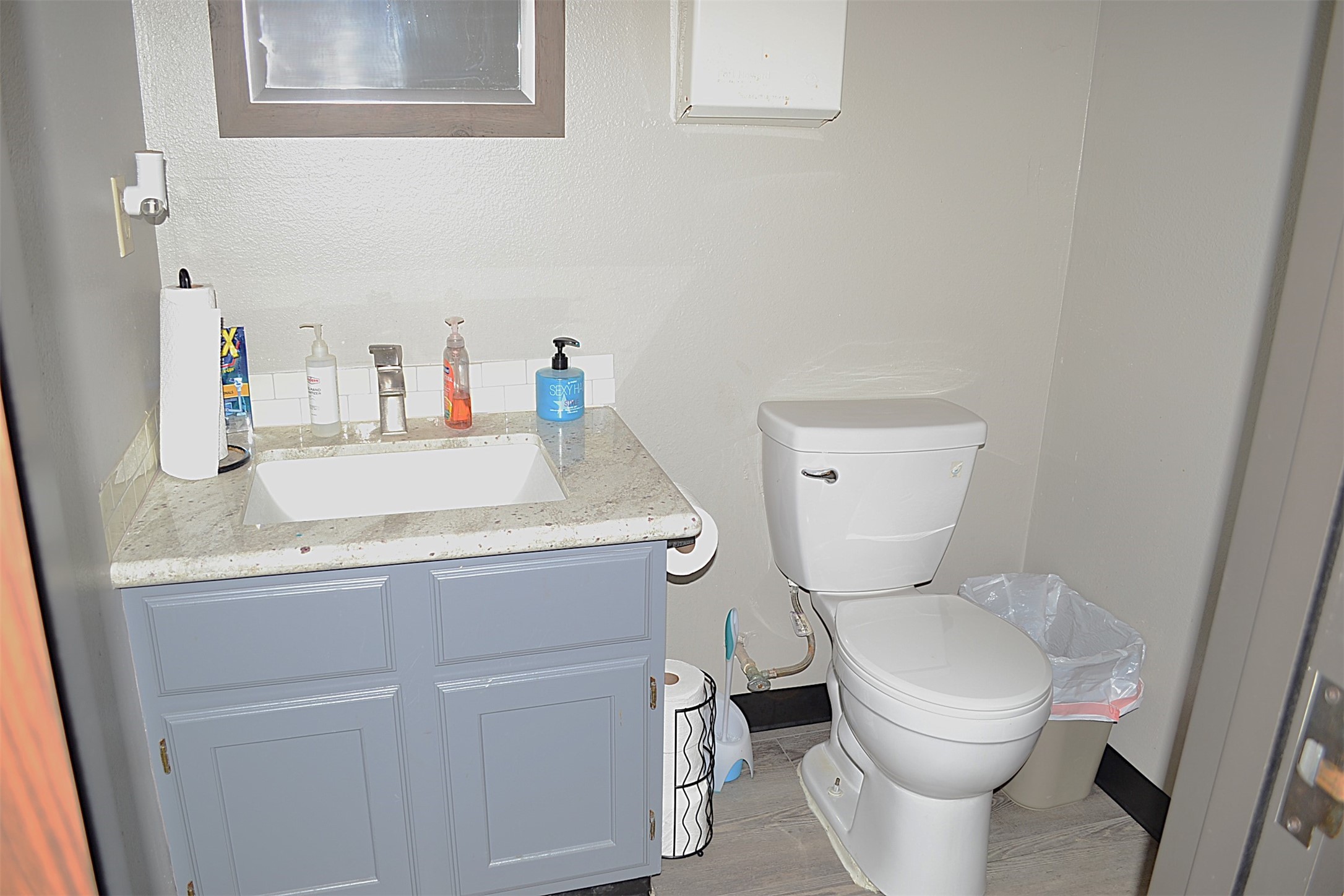 12122 Knigge Cemetery Road Cypress, TX 77429 - Photo 16 of 48 a white toilet sitting next to a bathroom sink