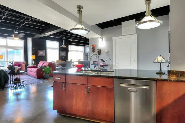 a kitchen with sink and cabinets