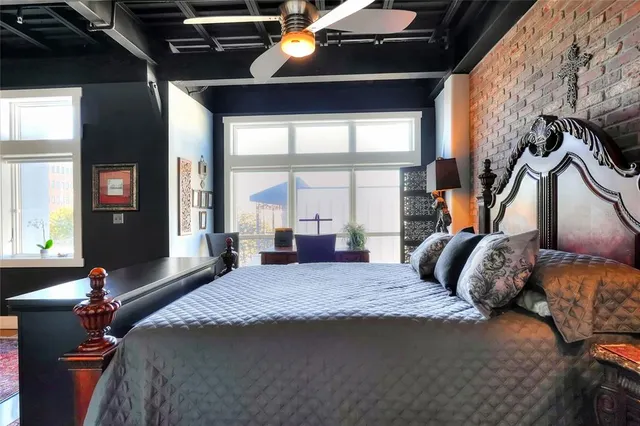 a bedroom with a bed and window