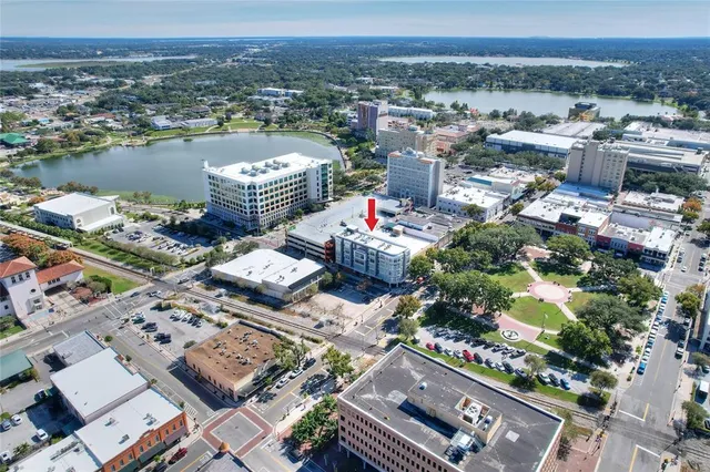 an aerial view of a city with lake view