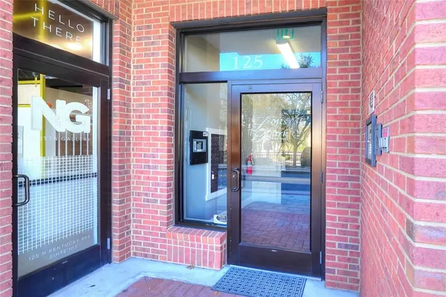 a view of a brick house with a large window
