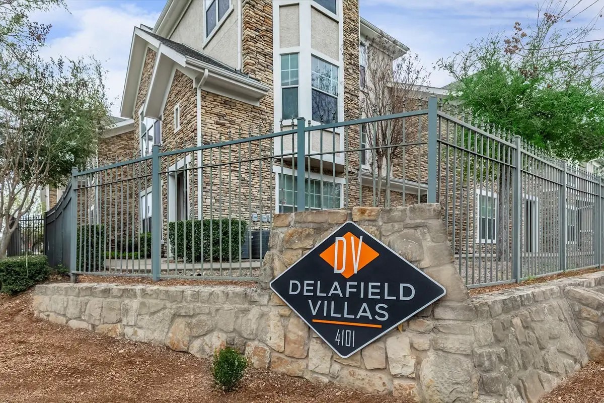 4101 Delafield Lane Dallas, TX 75227 - Photo 2 of 15 a sign on the side of a street