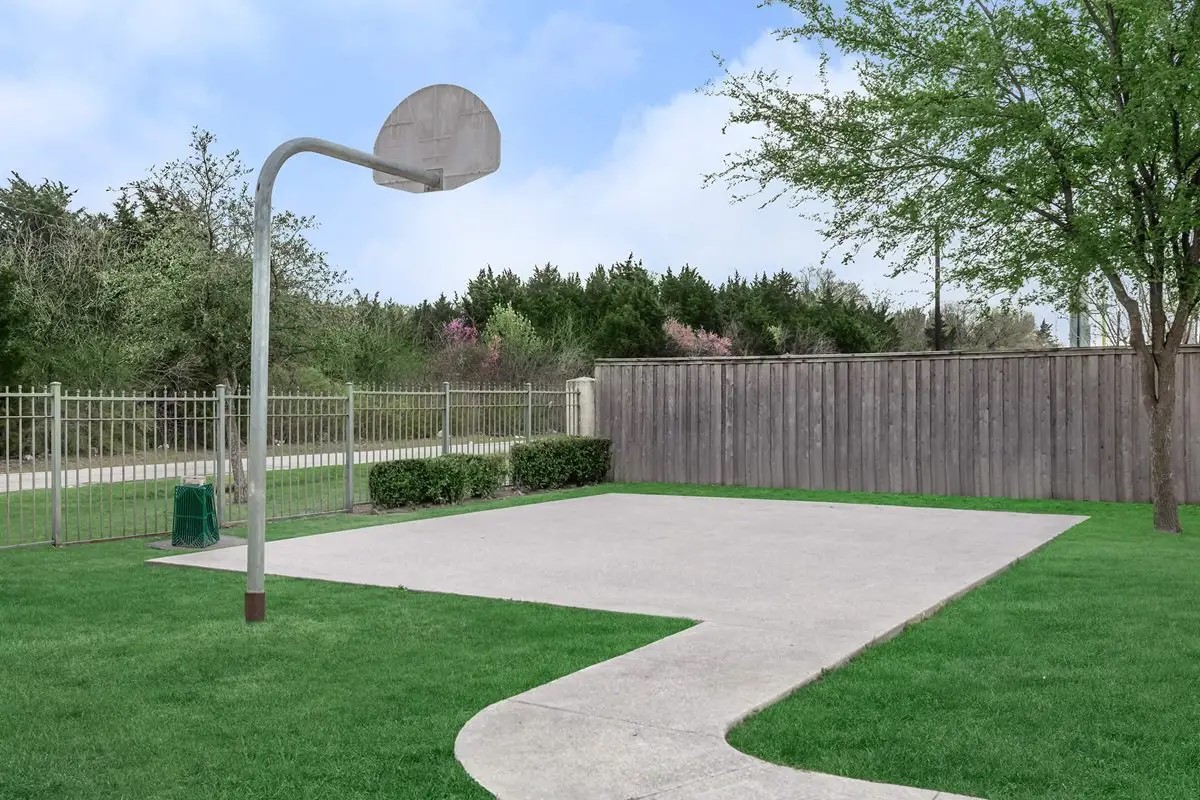 4101 Delafield Lane Dallas, TX 75227 - Photo 10 of 15 a view of a backyard with grass & palm tree