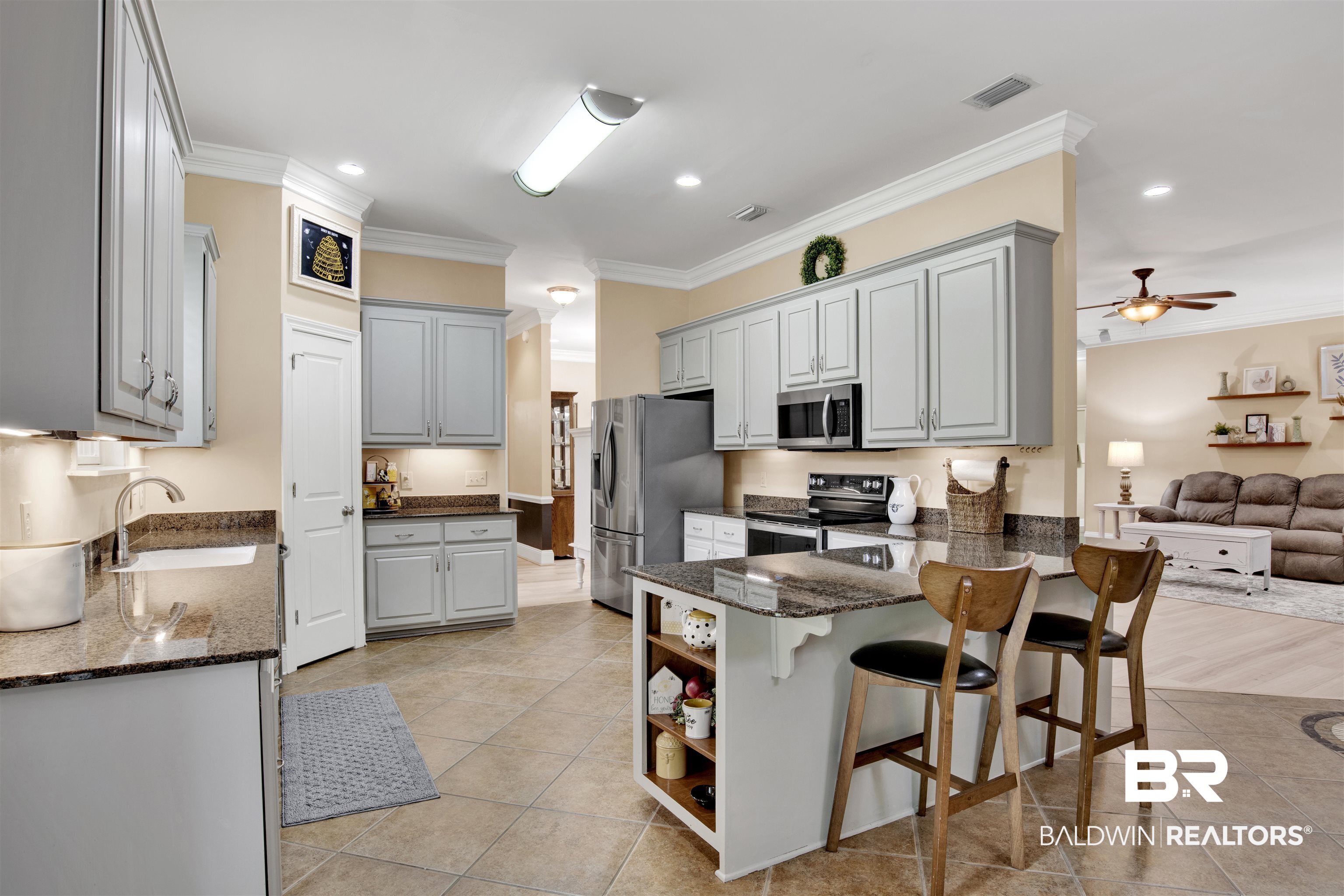 4340 Hamilton Oaks Lane Mobile, AL 36695 - Photo 8 of 51 Kitchen featuring gray cabinetry, appliances with stainless steel finishes, light tile flooring, and kitchen peninsula