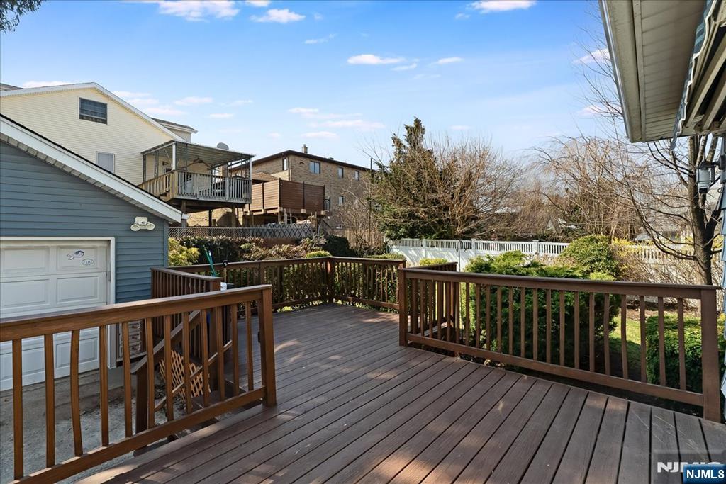 52 Manner Avenue Garfield, NJ 07026 - Photo 20 of 23 a view of a balcony with wooden floor and fence