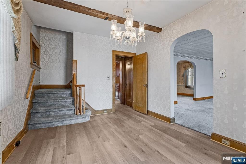 52 Manner Avenue Garfield, NJ 07026 - Photo 3 of 23 a view of a hallway view with wooden floor and staircase