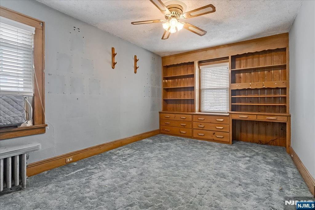 52 Manner Avenue Garfield, NJ 07026 - Photo 9 of 23 wooden floor in an empty room