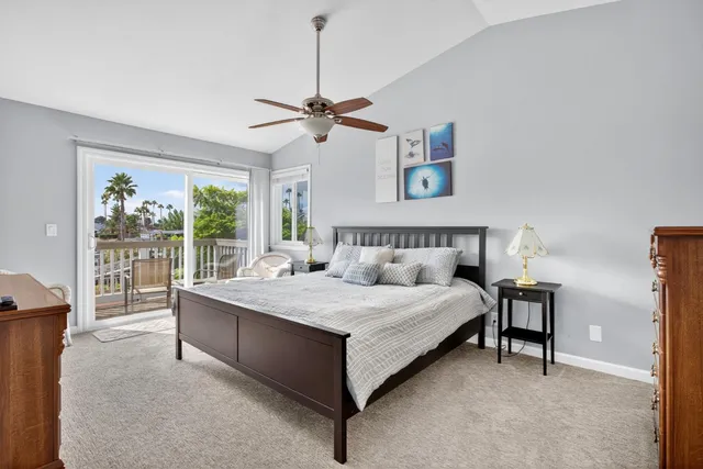 a bedroom with a bed couch and a window