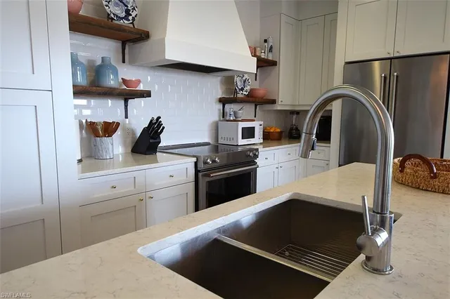 a kitchen with a stove and a refrigerator