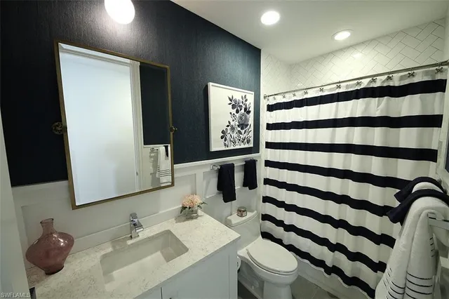 a bedroom with a bed and a fireplace