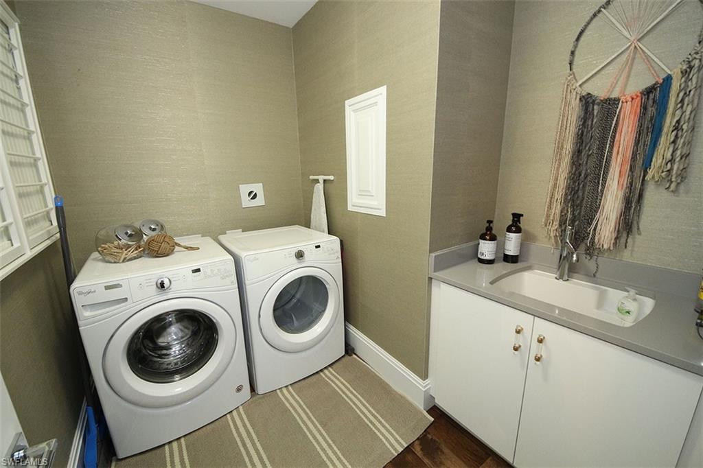 1035 3rd Avenue South, Unit 411 Naples, FL 34102 - Photo 34 of 49 a utility room with dryer and washer