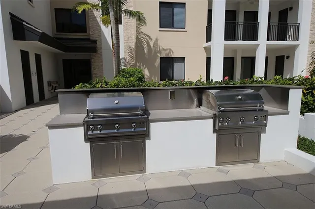 a view of a house with pool and chairs