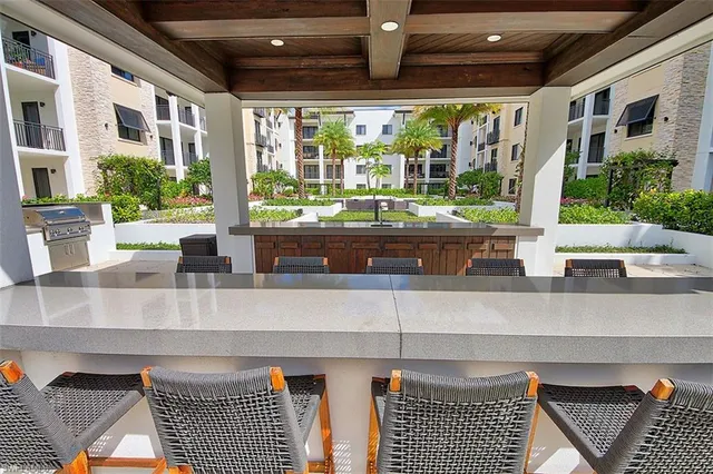 a kitchen with granite countertop a stove and a sink