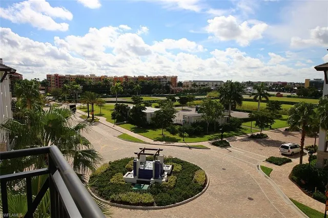 a view of a house with a patio and a yard