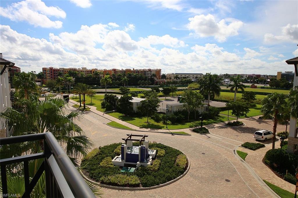 1035 3rd Avenue South, Unit 411 Naples, FL 34102 - Photo 42 of 49 a view of a swimming pool with outdoor seating