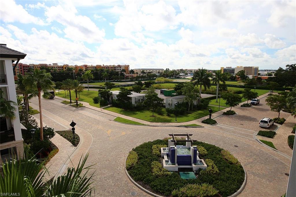 1035 3rd Avenue South, Unit 411 Naples, FL 34102 - Photo 44 of 49 a view of a swimming pool with a patio