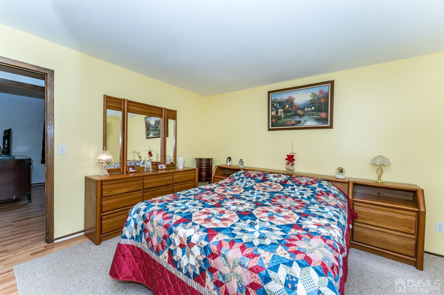 88 Stratton Street South Piscataway, NJ 08854 - Photo 13 of 22 a bedroom with a bed and dresser with mirror