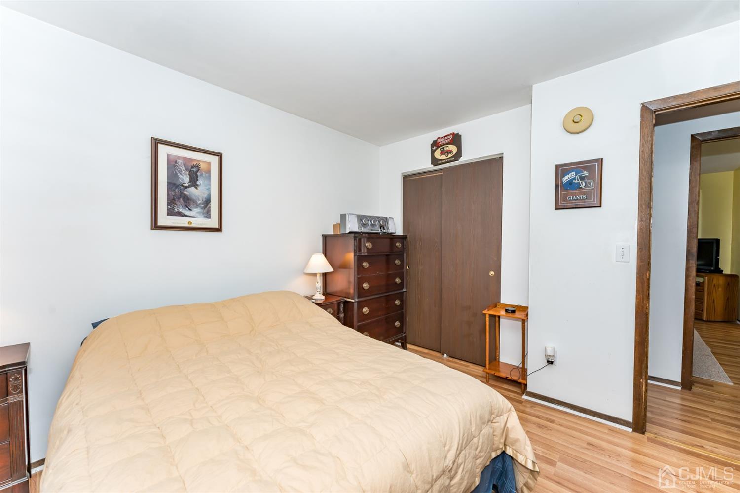88 Stratton Street South Piscataway, NJ 08854 - Photo 16 of 22 a bedroom with a bed and wooden floor