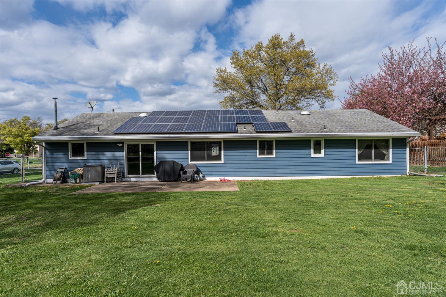 88 Stratton Street South Piscataway, NJ 08854 - Photo 21 of 22 a front view of a house with a garden and trees
