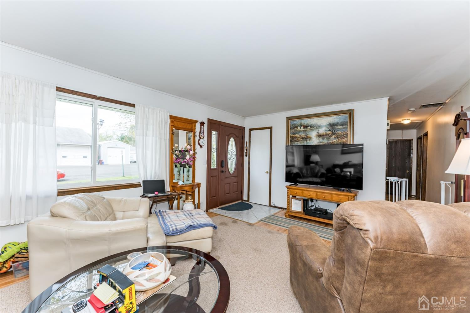 88 Stratton Street South Piscataway, NJ 08854 - Photo 4 of 22 a living room with furniture and a flat screen tv